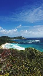 Scenic view of sea against blue sky