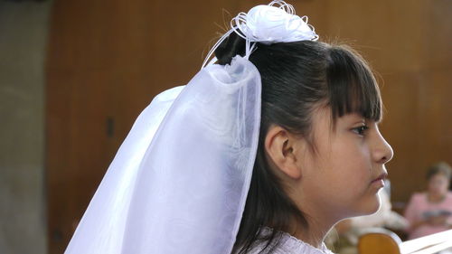 Portrait of girl wearing veil during wedding ceremony