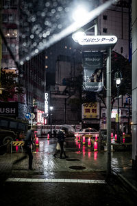 Wet street in city at night