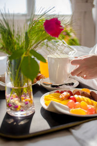 Midsection of person preparing food on table