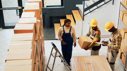 Low angle view of man sitting on staircase