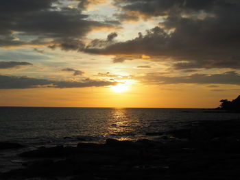 Scenic view of sea against sky during sunset