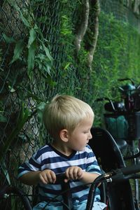 Boy sitting on bicycle