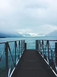 Pier over sea against sky