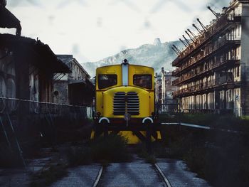 Train on railroad tracks against sky