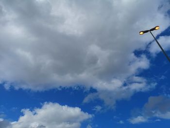 Low angle view of street light against sky