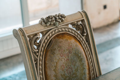 Close-up of old metal door on table