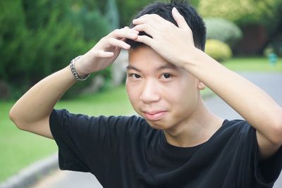 Portrait of young man standing outdoors