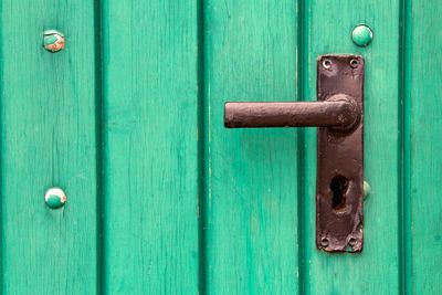 Close-up of closed turquoise door