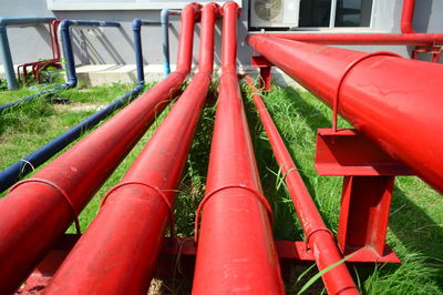 Red pipe in grass