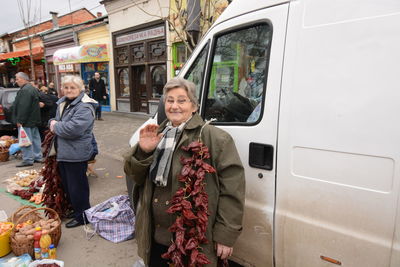 Portrait of man standing in bus