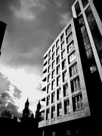 Low angle view of office building against sky