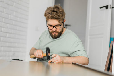 Portrait of young man working at office