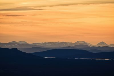 Scenic view of mountains against sky during sunset