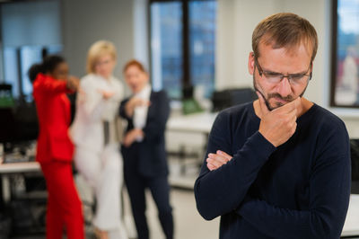 Portrait of businessman using mobile phone