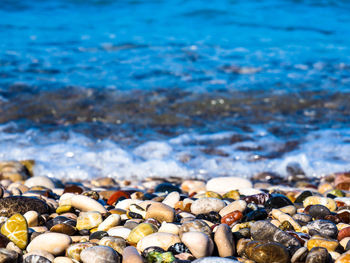 Close-up of pebbles at seashore