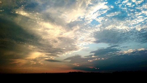 Silhouette of landscape against sunset