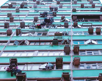 Facade of an apartment building with windows and air conditioning units