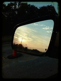 Reflection of clouds in river at sunset