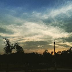 Scenic view of landscape against sky at sunset