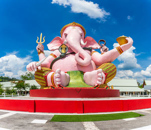 Low angle view of boy against sky