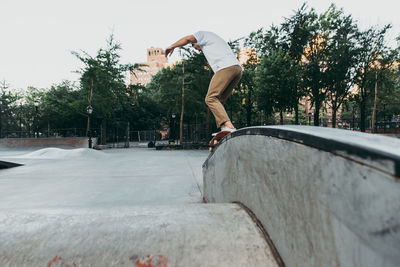 Man skateboarding on skateboard park