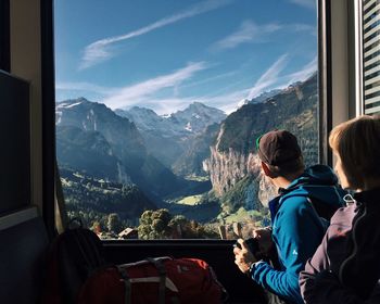 Woman sitting on mountain