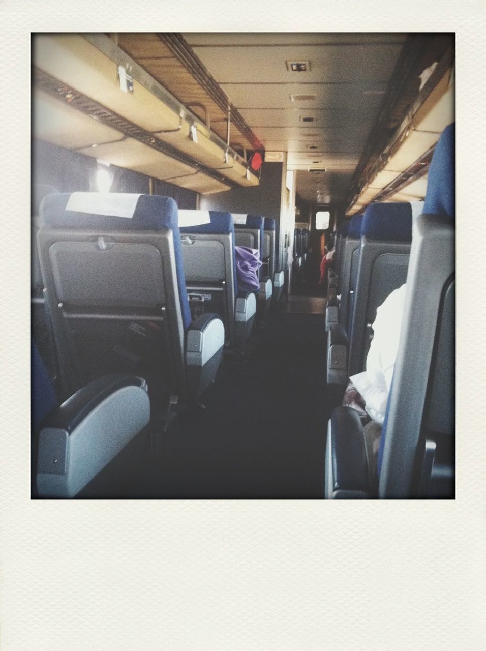 indoors, transfer print, transportation, auto post production filter, mode of transport, public transportation, architecture, built structure, ceiling, vehicle interior, travel, modern, empty, train - vehicle, airport, journey, interior, railroad station, high angle view, incidental people