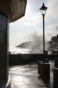 Street by sea against sky