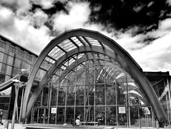 Low angle view of building against cloudy sky