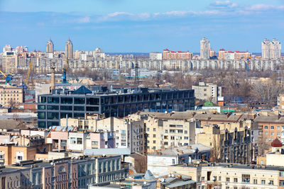 A modern office center made of dark glass and concrete in the old district of podil in kyiv.