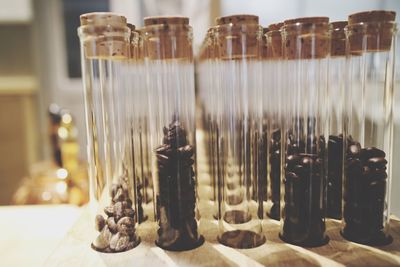 Close-up of roasted coffee beans in test tubes