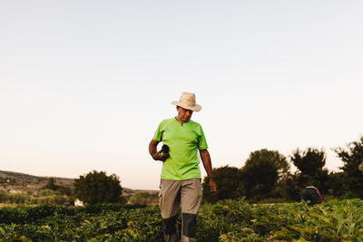 Low angle view of farmer working at farm