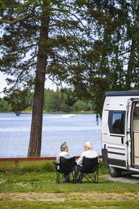 Senior couple camping by sea