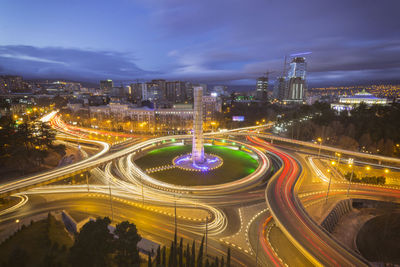 High angle view of light trails on road at night