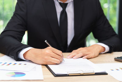 Midsection of a man on table