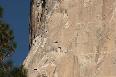 Low angle view of rock formation against sky