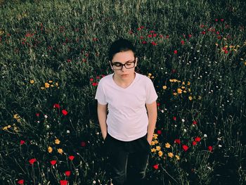 Portrait of smiling young woman in field