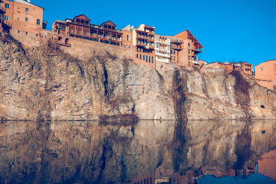 Low angle view of buildings against blue sky