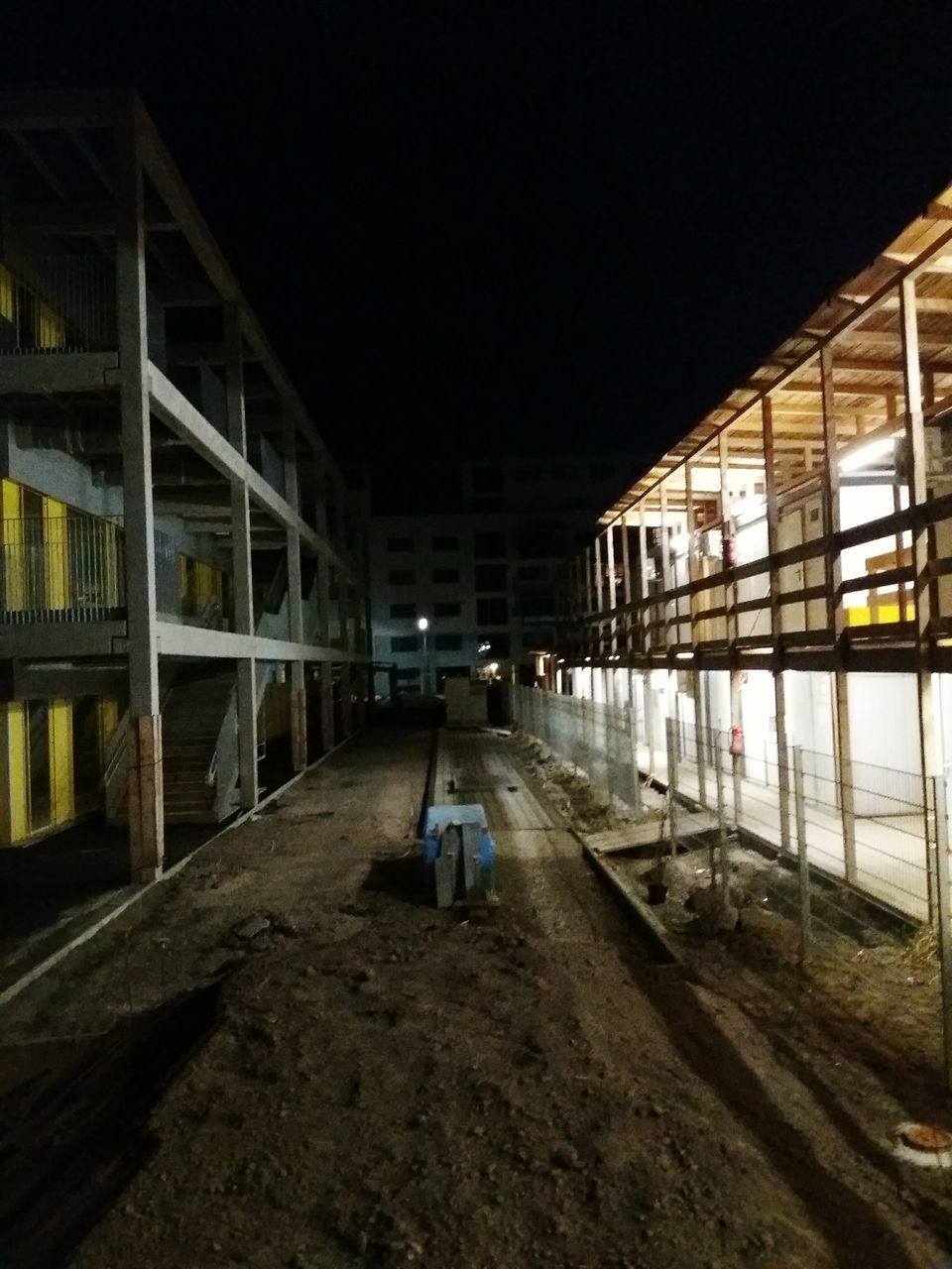 ILLUMINATED WALKWAY AT NIGHT