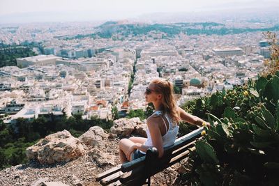 Young woman looking at cityscape