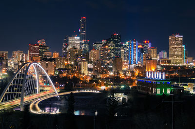 Illuminated city buildings at night