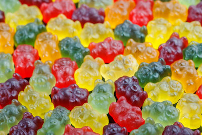 Closeup full-frame background of colorful jelly bears laid closely on flat surface