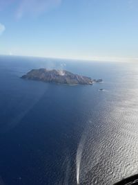 Scenic view of sea against blue sky