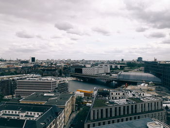 High angle view of buildings in city against sky