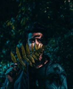 Portrait of young man standing outdoors