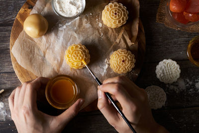 High angle view of person preparing food on table