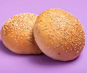 Close-up of burger against yellow background