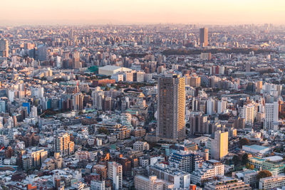 High angle view of modern buildings in city against sky