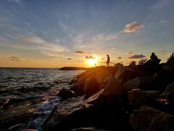 Scenic view of sea against sky during sunset